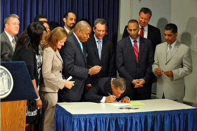 Photograph of Governor Paterson signing legislation to end the stop-and-frisk database from the governor's office